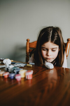 Girl Preparing to Paint at the Table