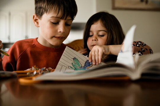 Brother and Sister Draw Together in Natural Light