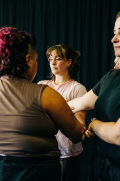 Women rehearsing acting exercise focusing on connection and trust