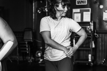 Woman practicing dance movement in dance studio