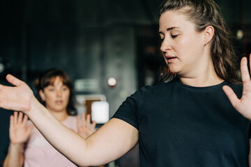 Women practicing self-defense techniques during martial arts training