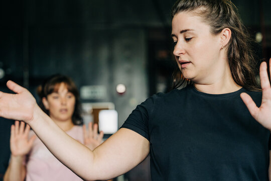 Women practicing self-defense techniques during martial arts training