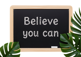 Black chalkboard with believe you can text and tropical leaves on transparent background.