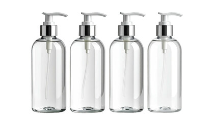 Four clear pump bottles, silver tops, against black backdrop