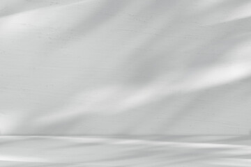 Obraz premium Shadow and Light on White Wall Wood Texture with Grey Floor Background,Empty Studio Room with sunlight overlay on table Top,Backdrop background Spring,Summer Cosmetic Product Display,Mockup Beauty