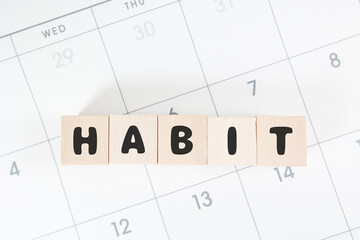 習慣化を示すカレンダーとHABITブロックのシンプル構図。