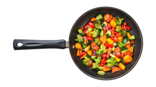 Stir fried vegetables in black pan isolated on a transparent background