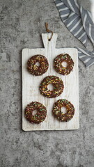 donuts with colourfull glaze on dark mood concept. Top view. Copy space