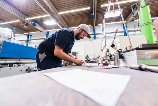 Man working at workbench in a factory