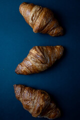 Fresh Croissants on black background