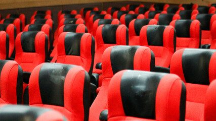 Empty rows of seats in the hall for large groups of people. Cinemas and theaters for watching shows.                               