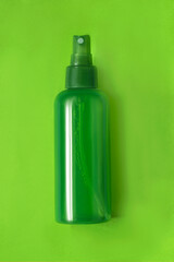 Bottle on green background