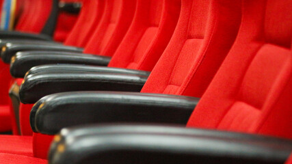 Empty rows of seats in the hall for large groups of people. Cinemas and theaters for watching shows.                               