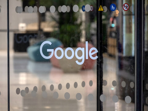 LONDON, UK - NOVEMBER 15, 2025:  Google logo sign on door of HQ building in Kings Cross