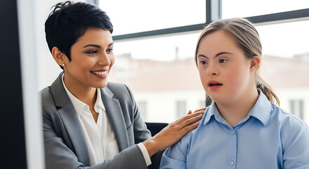 Supportive colleague with hand on shoulder of woman with down syndrome