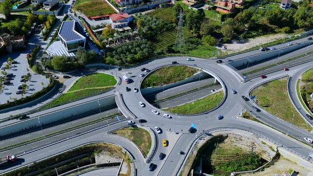 Top-down aerial video of Tirana&rsquo;s eastern highway roundabout showing traffic flow, modern infrastructure, and urban transport design.