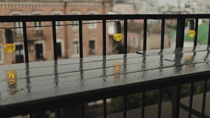 glistening rain on city ledge, serene urban balcony scene with gentle rain and soft glowing lights - Powered by Adobe