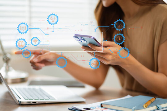 AI or Artificial Intelligence technology. Businessman using a smartphone and laptop computer chatting with an intelligent artificial intelligence.