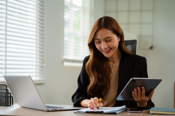 women doing finances and calculate on desk about cost at home office.