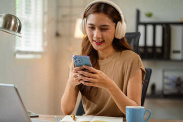 Businesswomen using smartphone payments online shopping at office.