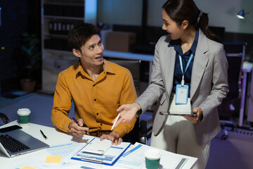 Teamwork process, Business team using a calculator to calculate the numbers of statistic business profits growth rate on documents graph data, desk in the office.