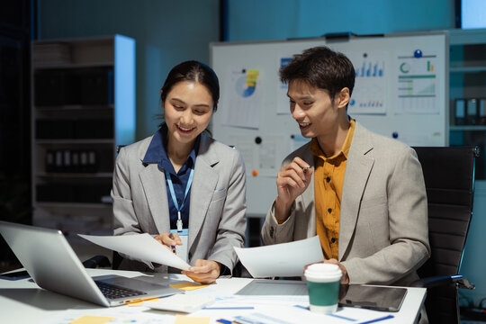Teamwork process, Business team using a calculator to calculate the numbers of statistic business profits growth rate on documents graph data, desk in the office.