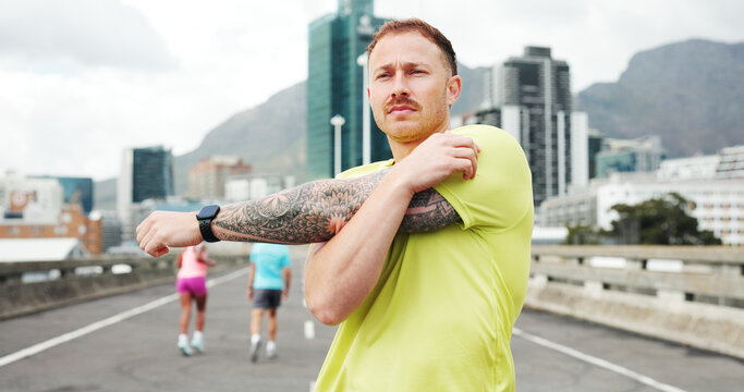 Man, fitness and stretching with arms in city for workout preparation or outdoor exercise. Active, male person or getting ready with body warm up for flexibility, physical activity or training - Powered by Adobe