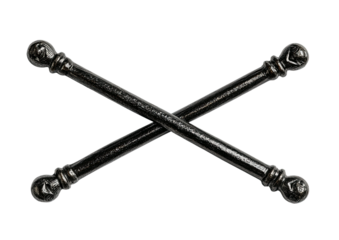 Crossed, dark, textured rods with sphere finials