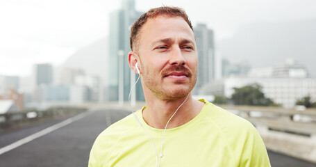 Thinking, earphones and man in city, fitness and calm with sound, exercise and audio tech. Playlist album, healthy person and runner with training, podcast and listening to music and streaming radio