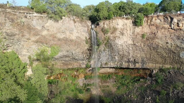 Waterfall of the hacienda of hidalgo San miguel regla, hotel and touristic and historical place, flight in drone over the church or chapel of the old house