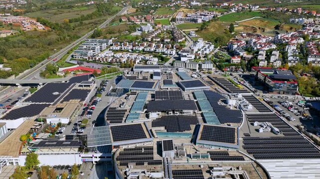 Aerial video of solar panel rooftops and eco-friendly buildings in Tirana&rsquo;s eastern area, promoting renewable energy and green technology.
