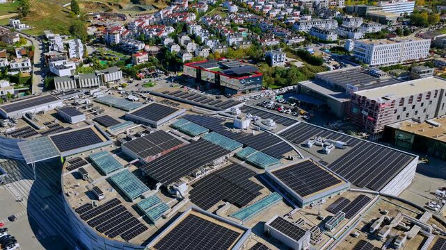 Aerial video of solar panel rooftops and eco-friendly buildings in Tirana&rsquo;s eastern area, promoting renewable energy and green technology.