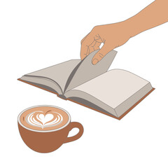 Hand turning pages of an open book next to a cup of coffee.