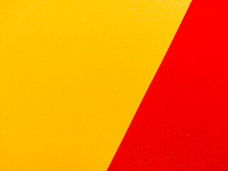 Yellow and red color paper background, texture, copy space, diagonal. Diagonal line the concept of needlework, creativity, applique, art.