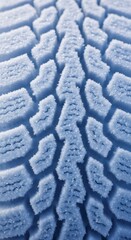 Car tire tread covered in fresh snow. Close up view on winter vehicle tire pattern, symbolizing safe driving and cold weather conditions.