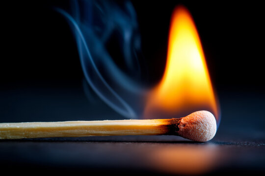 Close up, Burning Matchstick in a Dark Room