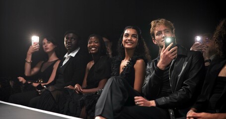 People, crowd and catwalk with phone for fashion show, garment collection or designer brand. Group, audience and photography for clothing line, outfit or publicity for new aesthetic trend or wardrobe