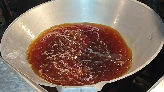 Deep fried dough stick in hot oil.