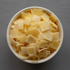 Hard Shaved Parmesan Cheese in a Bowl, top view.