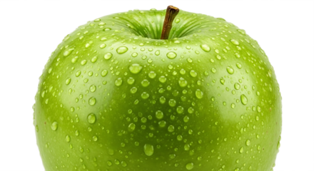 A close up view of a green apple with water droplets on its surface against a black background