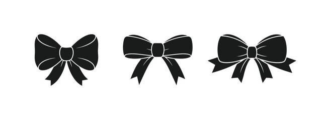 A formal black and white butterfly is tied with a silk bow tie ribbon accessory on a white background