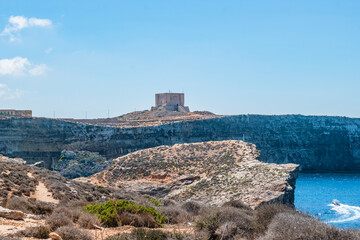 Fototapeta premium Saint Mary's Tower (the bastioned watchtower) on cliff top, Comino MALTA