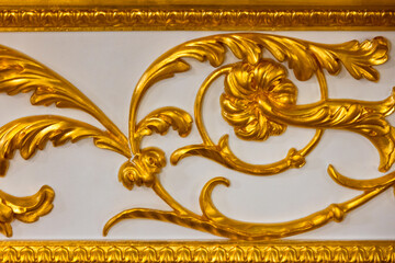 Luxurious gilded floral panel featuring intricate scroll work and botanical motifs