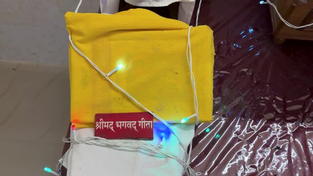 holy bhagavad gita wrapped in yellow cloth the holy scripture of hindu during religious ceremony