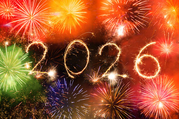 2026 written with fireworks on a night sky as a new year background