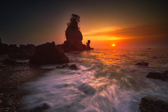 Sunset on the beach at Pantai Karang Agung Kebumen Central Java Indonesia