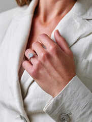 Closeup Elegant Woman Wearing Diamond Engagement Ring White Linen Blazer