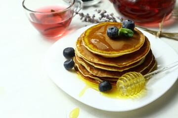 Tasty homemade pancakes with honey and berries