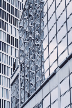 Architecture in Frankfurt merging corporate skyscraper finance fa&ccedil;ade reflection modern glass structure and urban contrast within a dynamic vertical cityscape