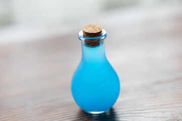 Close-Up of Cleaning Brush in Glass Bottle
